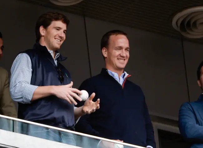 Eli and Peyton Manning (May 4, 2014)
