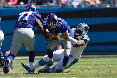 Kevin Boothe (77) and Eli Manning, New York Giants (September 22, 2013)